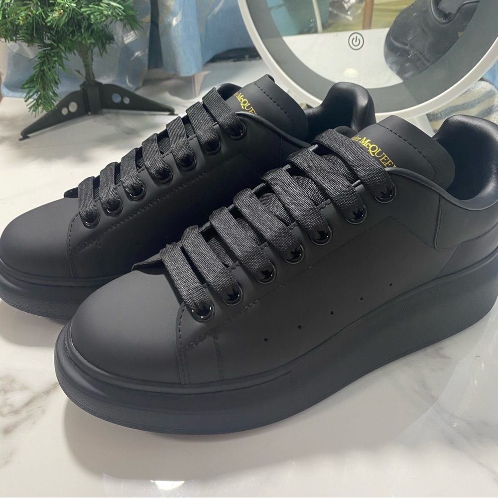 Alexander McQueen Black Sneakers with Gold Accents